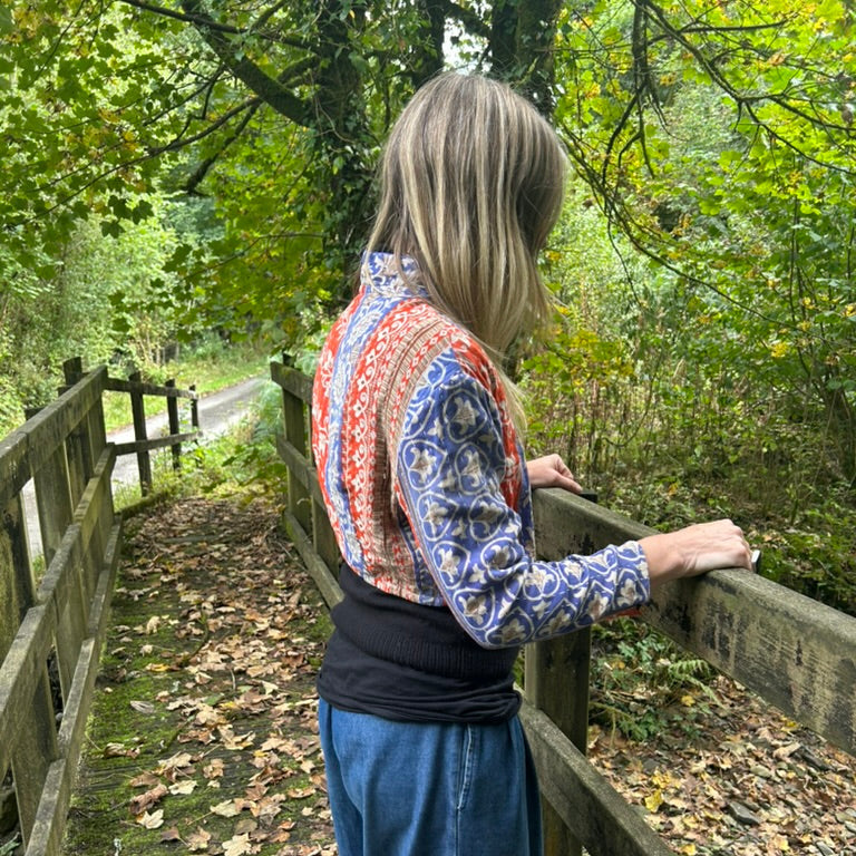 Side view of Saffron Sky Gudri Jacket in red, cobalt blue and cream reclaimed cotton with traditional kantha stitching