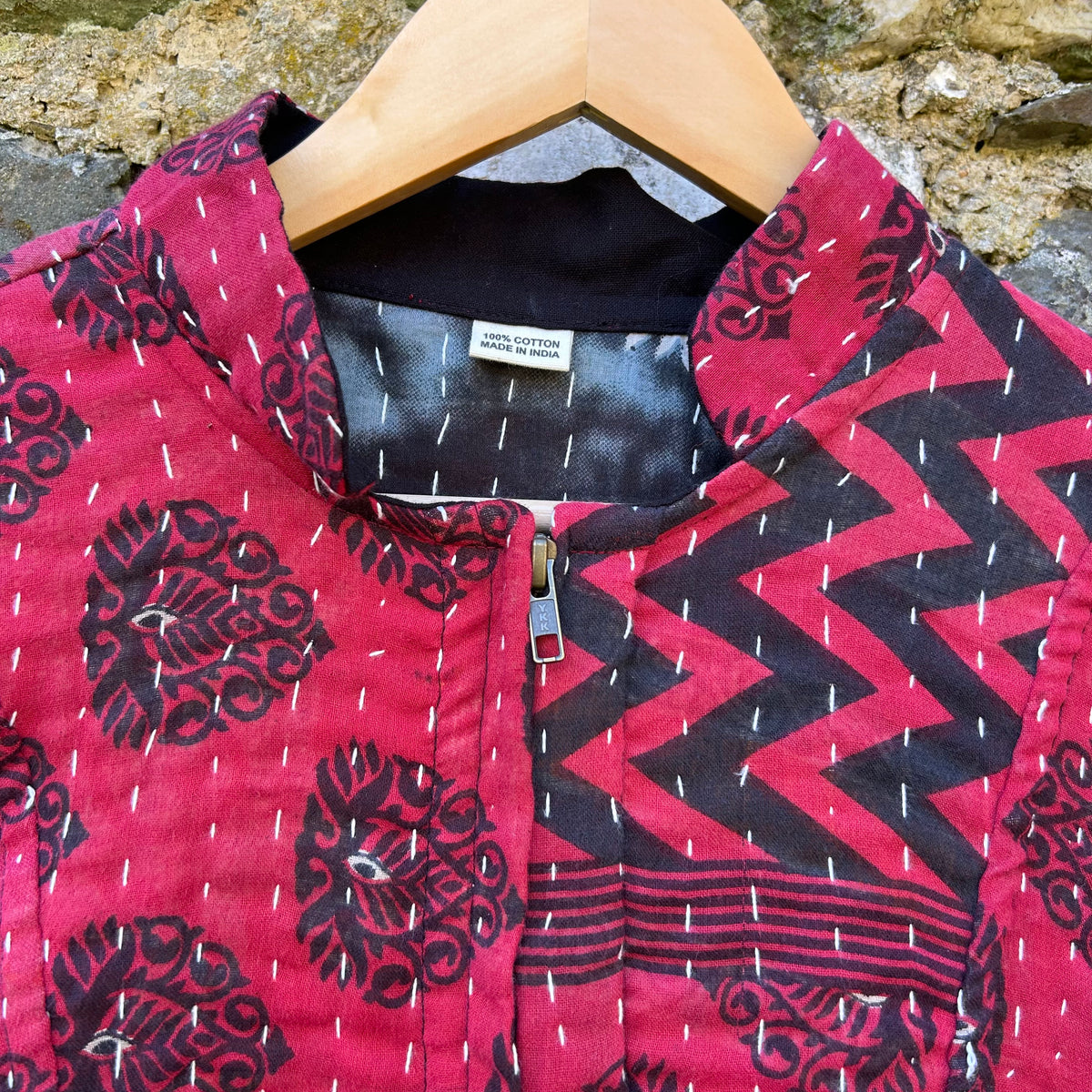 Red and black Gudri jacket neckline and zip detail with kantha stitching