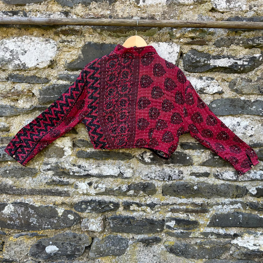 Red and black women’s Gudri jacket made from reclaimed cotton with kantha stitching, back view