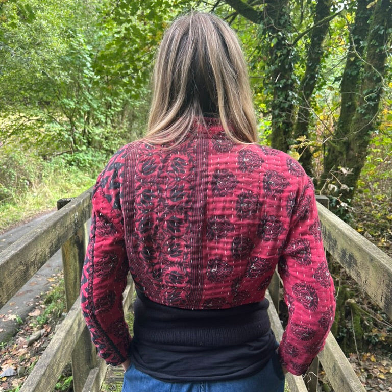 Back view of red and black Crimson Trail Gudri jacket with traditional kantha running stitch