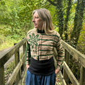 Woman wearing the Forest Bloom green and stone reclaimed cotton Gudri jacket with kantha stitching