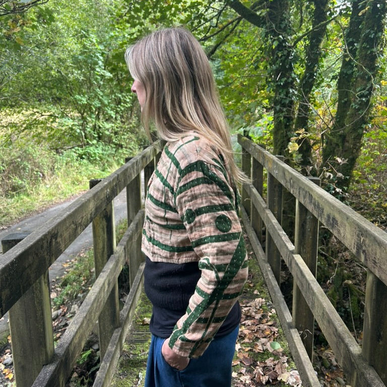 Side profile of Forest Bloom green and stone Gudri jacket showing cropped fit and kantha stitching
